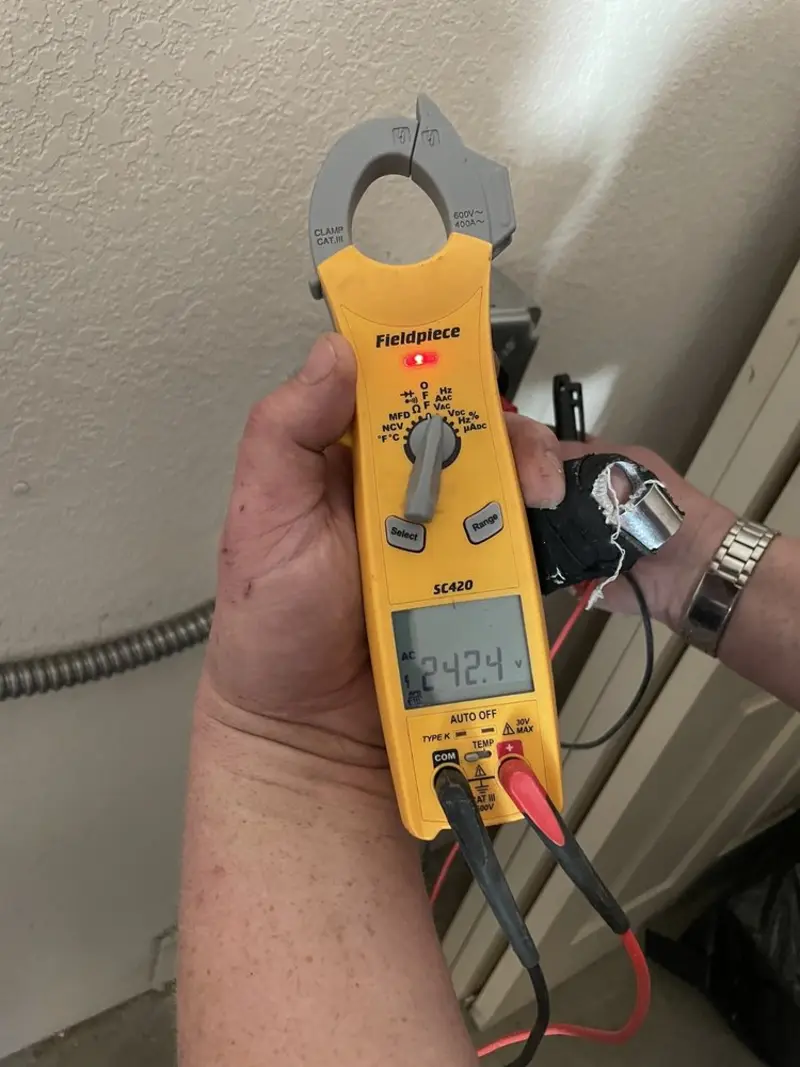 Voltage testing with clamp meter during Aluminum Wiring Replacement in East Dundee